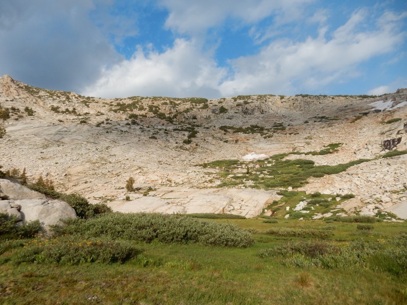 Granite shelves and large talus piles east of the easy pass
